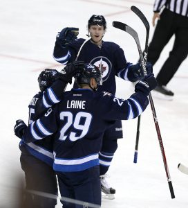 WINNIPEG, MANITOBA - OCTOBER 13: Patrik Laine #29, playing his first NHL game, of the Winnipeg Jets celebrates scoring his first NHL goal against the Carolina Hurricanes during NHL action on October 22, 2016 at the MTS Centre in Winnipeg, Manitoba. (Photo by Jason Halstead /Getty Images)