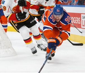 EDMONTON, AB - OCTOBER 12: Jesse Puljujarvi #98 of the Edmonton Oilers is pursued by Micheal Ferland #79 and Michael Frolik #67 of the Calgary Flames on October 12, 2016 at Rogers Place in Edmonton, Alberta, Canada. (Photo by Codie McLachlan/Getty Images)