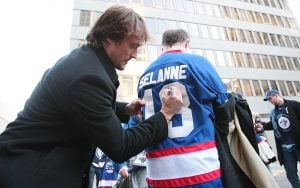 WINNIPEG, CANADA - DECEMBER 17: Teemu Selanne of the Anaheim Ducks greets fans as he leaves to take the bus to the MTS Centre outside the Fairmont Hotel in downtown Winnipeg on December 17, 2011 in Winnipeg, Manitoba, Canada. Selanne and the Anaheim Ducks are set to play against the Winnipeg Jets tonight at the MTS Centre. This is the first time Selanne has returned to play hockey in Winnipeg, where he began his NHL hockey career with the original Winnipeg Jets in 1992. He was traded in 1996. (Photo by Marianne Helm/Getty Images)