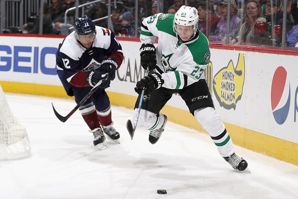 DENVER, CO - DECEMBER 03: Jarome Iginia #12 of the Colorado Avalanche skates for the puck against Esa Lindell #23 of the Dallas Stars at the Pepsi Center on December 3, 2016 in Denver, Colorado. (Photo by Matthew Stockman/Getty Images)