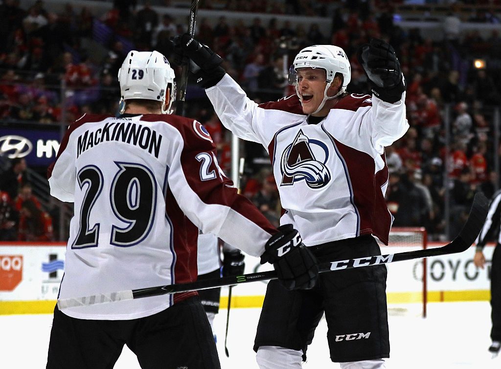CHICAGO, IL - DECEMBER 23: Mikko Rantanen #96 of the Colorado Avalanche greets teammate Nathan MacKinnon #29 after MacKinnon scored the game-winning goal against the Chicago Blackhawks at the United Center on December 23, 2016 in Chicago, Illinois. The Avalanche defeated the Blackhawks 2-1 in overtime. (Photo by Jonathan Daniel/Getty Images)